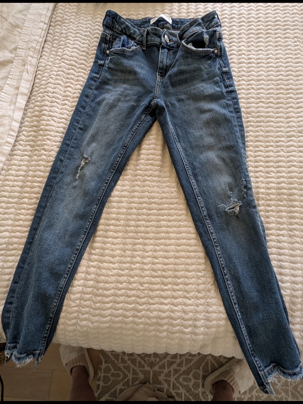 Zara Skinny Jeans with distressed medium wash and frayed hems.